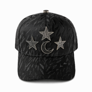 Black baseball cap with leaf texture and celestial rhinestone embellishments on white background.