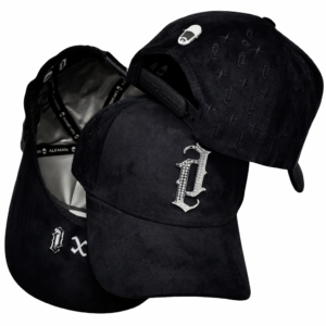 Three black designer baseball caps with Gothic embroidery and metallic “D” emblem.