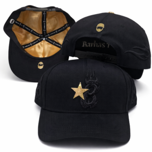 Black baseball cap with gold star and flame embroidery, gold logo, and satin lining.