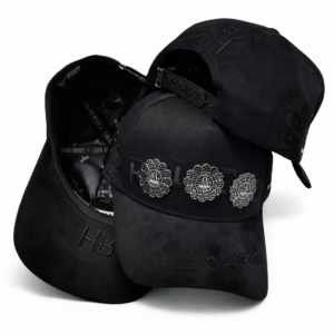 Three black baseball caps with metallic floral embellishments and embroidered branding on a white background.