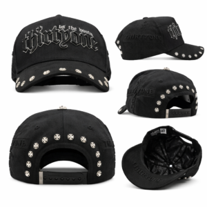 Black baseball cap with silver skull studs and gothic “thirtyone” embroidery on white background.