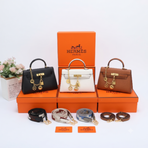 Premium Leather Top-Handle Trapeze Handbag with Decorative Charms